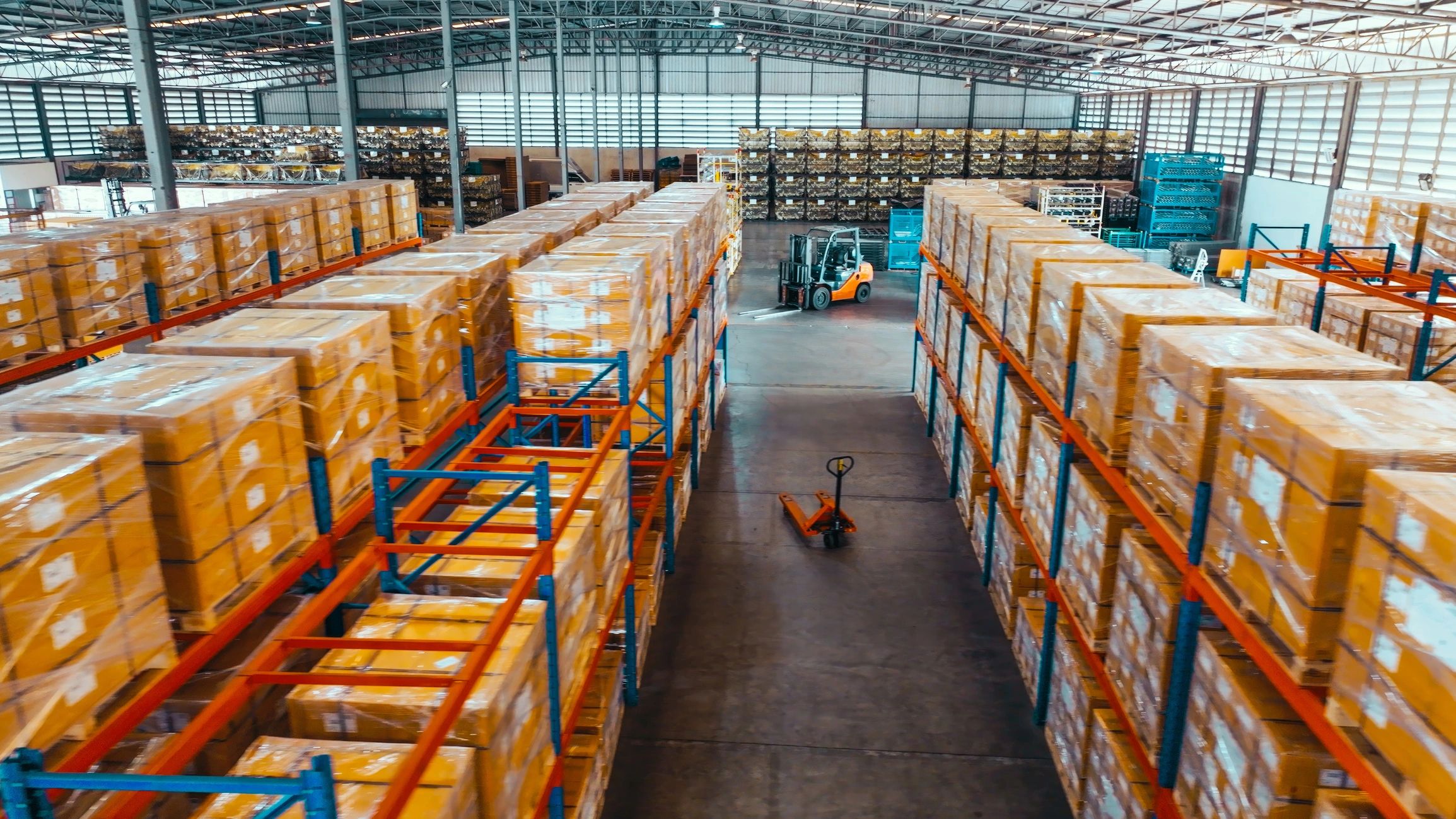 High-angle view of warehouse racks with packaged merchandise