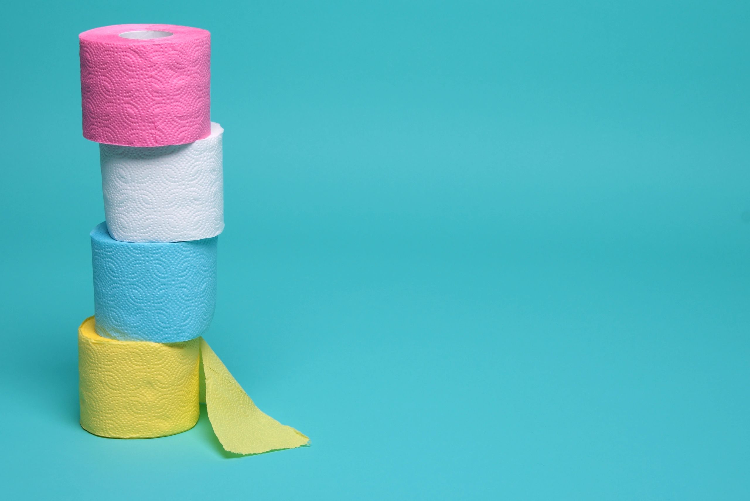 Toilet paper rolls stacked together